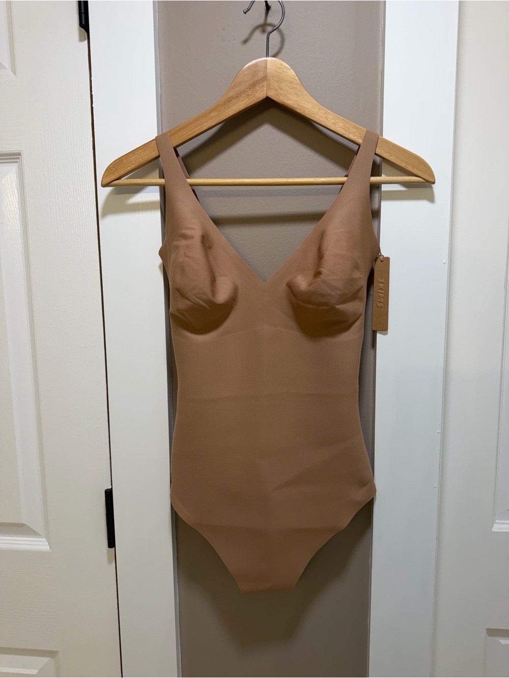 SKIMS Body CS Plunge Thong Bodysuit in Sienna